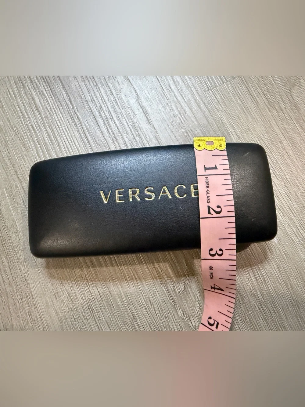 Versace Black Case with Gold Lettering